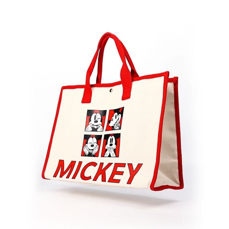 Cream canvas tote bag with red trim, featuring Mickey Mouse illustrations and red text.