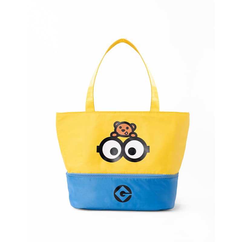 Yellow and blue tote bag featuring Minion goggles, a small teddy bear, and Gru's logo.
